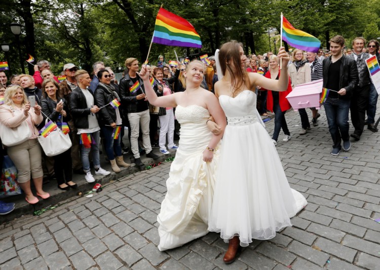 Two of the more than 15,000 participants march through downtown Oslo during the Euro Pride gay parade in Oslo on Saturday. President Barack Obama’s administration has taken the U.S. gay rights revolution global, using American embassies across the world as outposts in a struggle that still hasn’t been won at home. With gay pride parades taking place in many cities across the world this weekend, the U.S. role will be more visible than ever.