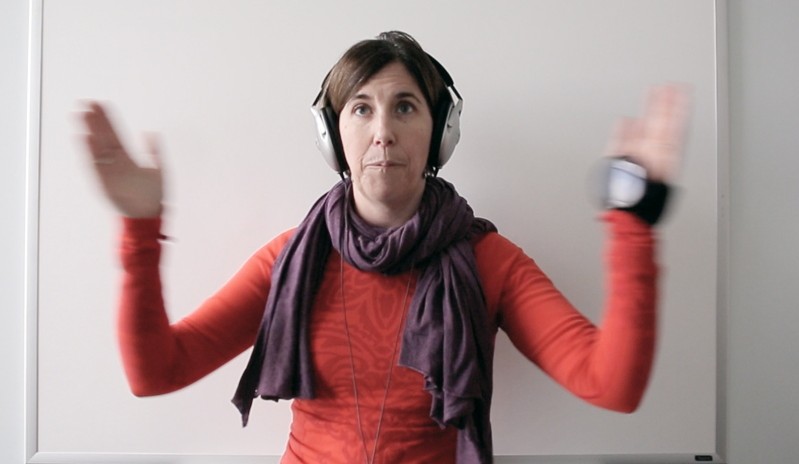 Meredith Bell claps to the beat of a metronome during a physical therapy session at Goodwill NeuroRehab Services in Portland. The exercise uses rhythm and timing to improve her attention and coordination skills.  Bell, 43, is recovering from a traumatic brain injury she suffered when she fell on ice last year.