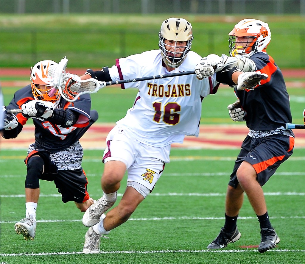 Taylor Browne of Thornton Academy tries to power his way upfield through the Biddeford defense on Wednesday during the Trojans’ 15-1 quarterfinal win. Gordon Chibroski/Staff Photographer