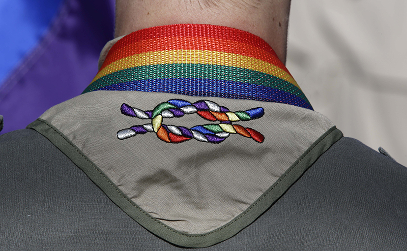 A Boy Scout wear his kerchief during the Salt Lake City’s annual gay pride parade Sunday in Salt Lake City. The Associated Press