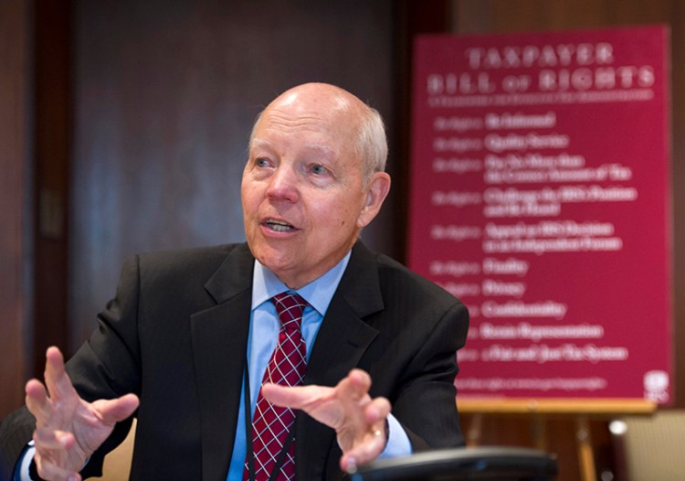 Internal Revenue Service (IRS) Commissioner John Koskinen announces that the IRS is adopting a Taxpayer Bill of Rights during a news conference at IRS headquarters in Washington, Tuesday. The Associated Press