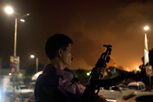 A Pakistani soldier takes position at Jinnah International Airport  where security forces fought Taliban gunmen who disguised themselves as police guards and stormed a terminal used for VIPs and cargo on June 8, 2014.