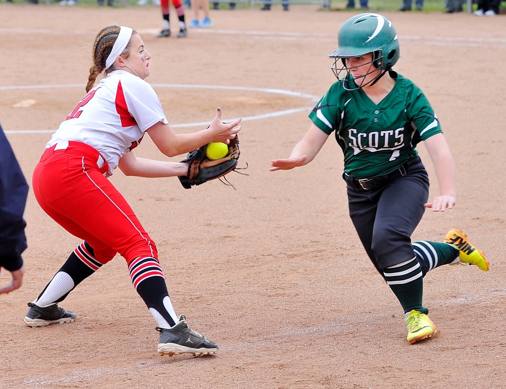 Bonny Eagle runner Victoria Cady overruns third base and is tagged out by Taylor Bacheldor during Thursday’s game in South Portland. Gordon Chibroski/Staff Photographer