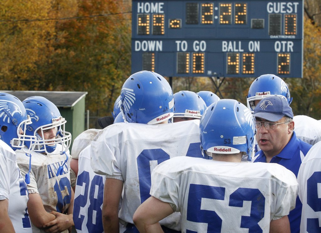 Sacopee Valley football coach Chuck Hamaty talks with his players during the 2012 season. Derek Davis/Staff Photographer
