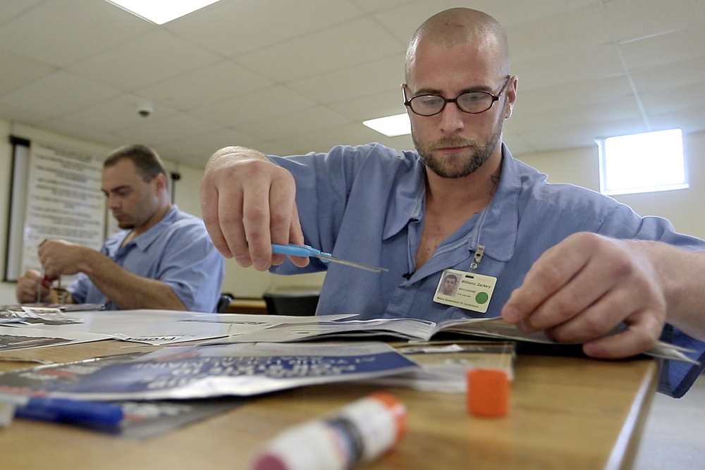 Adam Gray, left, and Zackery Williams take part in a class called InsideOut Dad at the Maine Correctional Center in Windham.