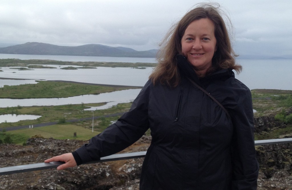 Amber Lambke stands in front of barren Icelandic terrain during a recent trade trip. Lambke met with a milling company, a feed-grade grain supplier and a produce supplier to explore markets for her company's products. Courtesy Photo