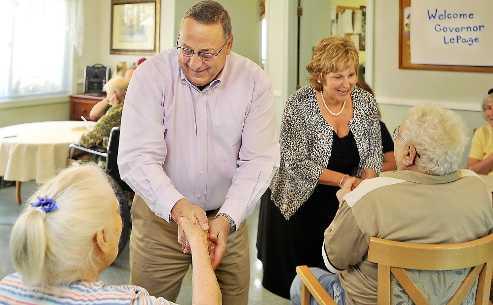 Gov. Paul LePage and first lady Ann LePage visit a nursing home in Yarmouth on July 11. The governor said Thursday that surplus from the state’s Medicaid program will provide $13.1 million for Maine's 106 nursing homes.