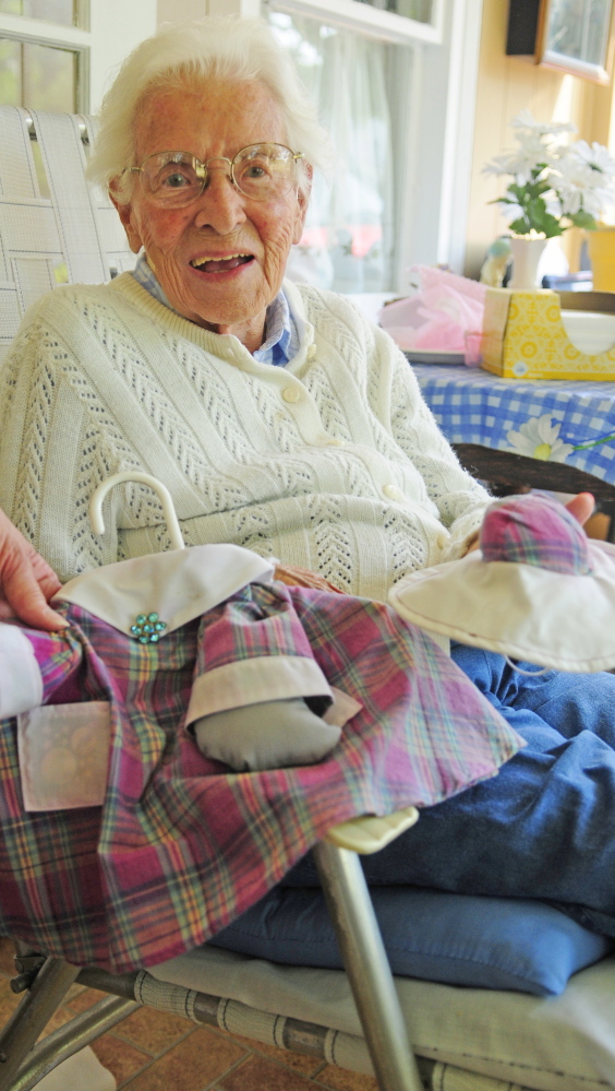 Marjorie Scott talks about her concrete goose on Wednesday in front of her Eastern Avenue home in Augusta.