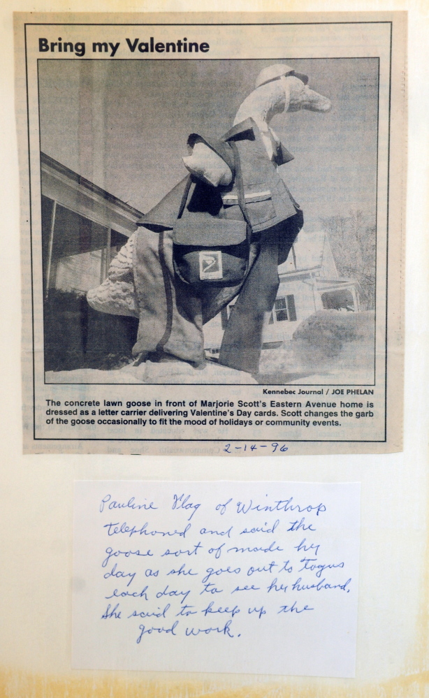 Marjorie Scott has a scrap book for the concrete goose in front of her Eastern Avenue home in Augusta. She has been dressing it up for 20 years. This 1996 photo shows a Postal Service letter carrier outfit for Valentine’s Day.