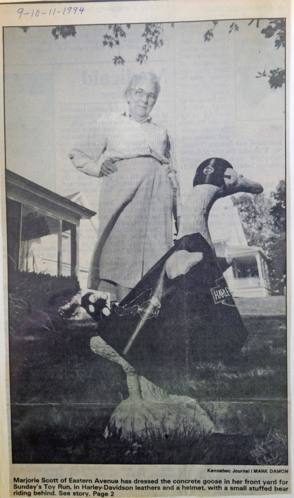 Staff photo by Joe Phelan
Marjorie Scott has a scrap book for the concrete goose in front of her Eastern Avenue home in Augusta. She has been dressing it up for 20 years. This 1996 motorcycle themed outfit was in honor of the United Bikers of Maine Toy Run.