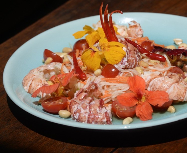 Green papaya and carrot salad served with Maine lobster.