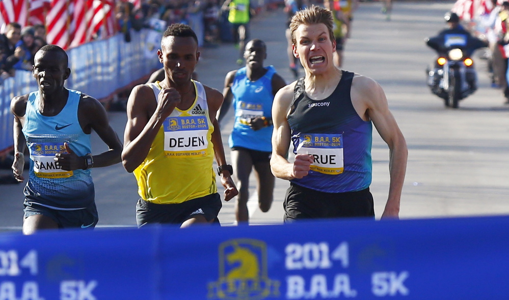 Ben True, right, heads to the finish in the Boston Athletic Association’s 5K, barely losing. True said of the Beach to Beacon: “When I toe the line in any race, I’m looking to win.”