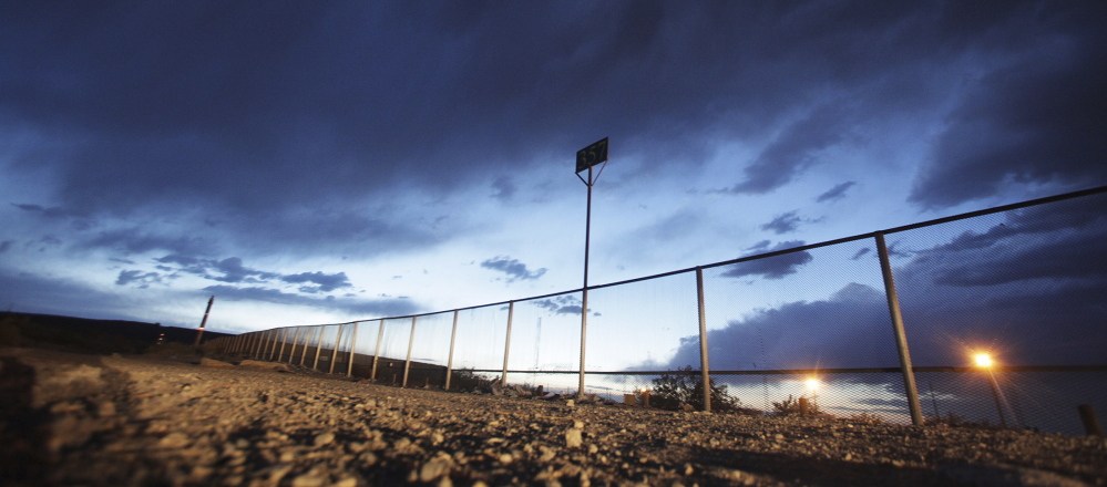 The fence marking the border between Mexico and the U.S. The illegal entry of thousands of Central American children without their parents has set off a humanitarian crisis that demands congressional action.