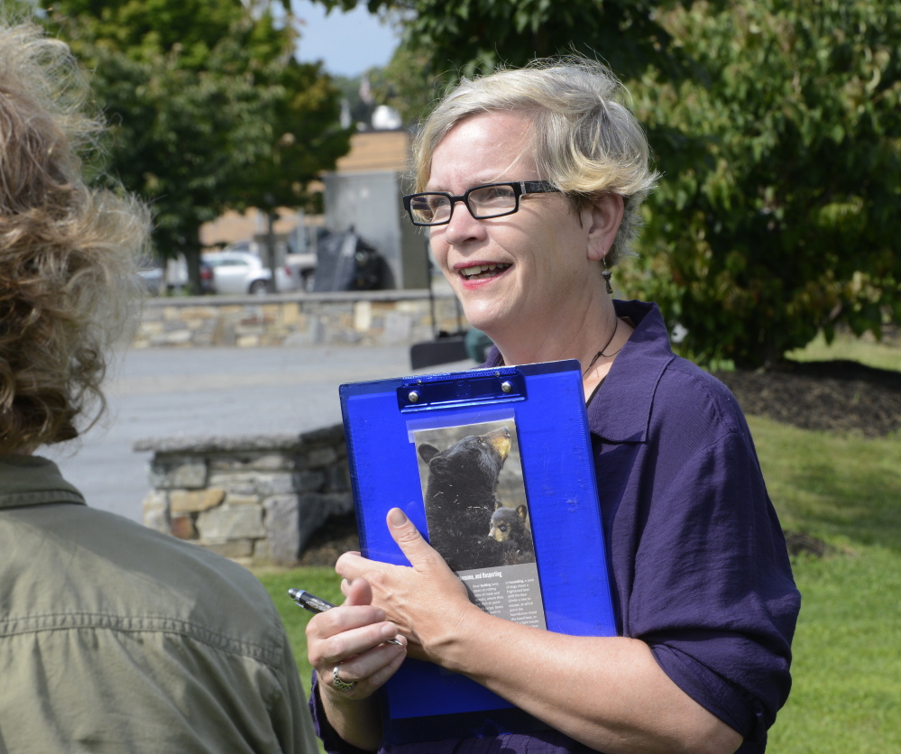 Annie Wadleigh talks with city officials about beefing up the bee-friendly plantings along the Bayside Trail.