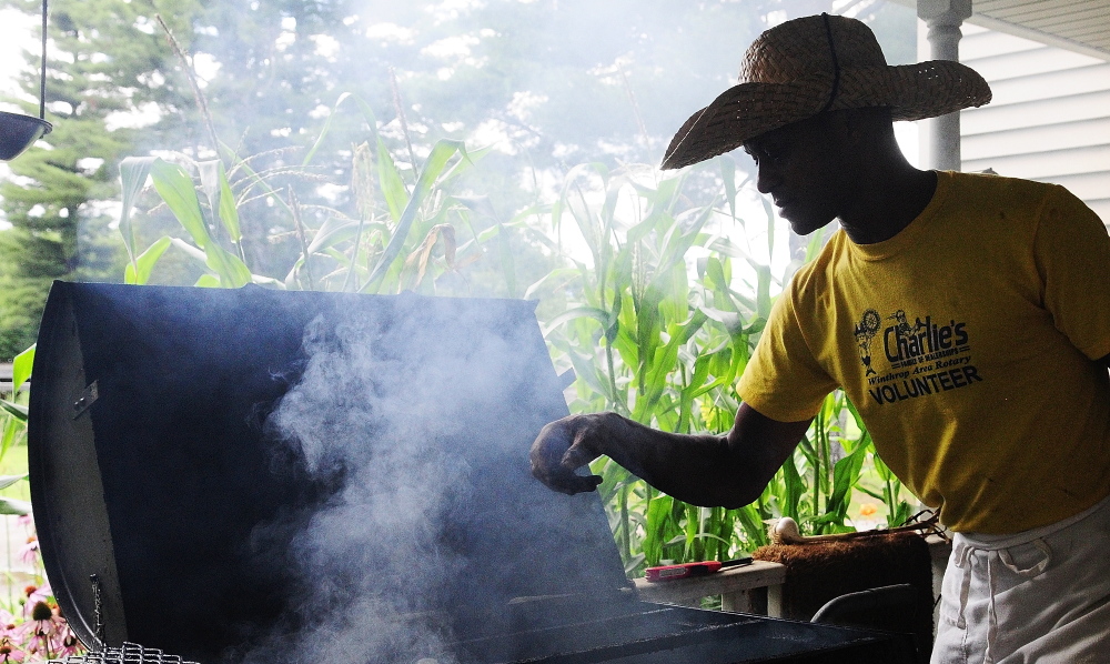 Craig Hickman prepares a smoker Thursday at his home in Winthrop. He and other volunteers were getting ready for the third annual Family Barbecue & Gumbo Festival to End Hunger on Saturday afternoon in Winthrop.