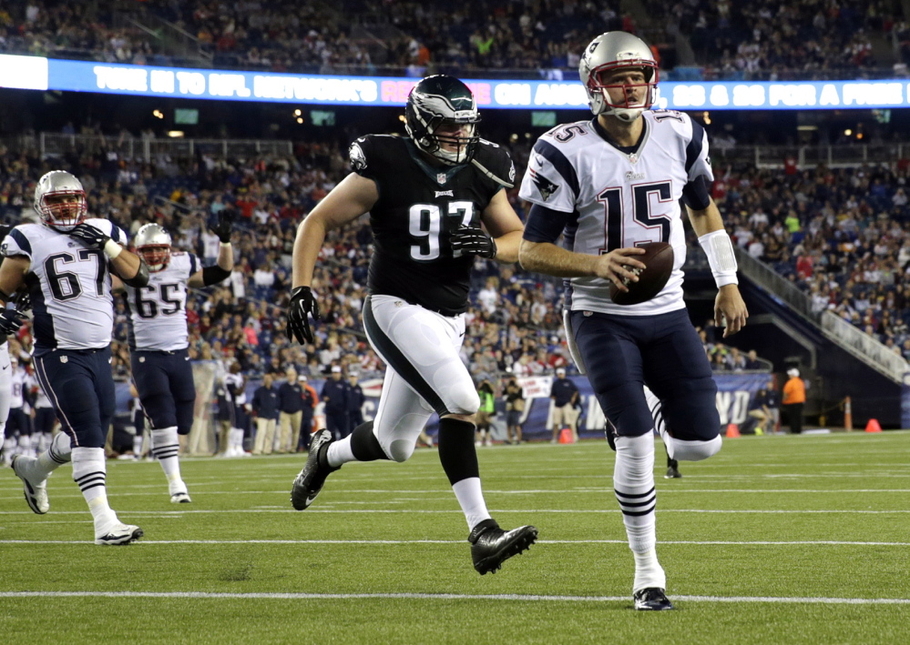 Ryan Mallett runs into the end zone ahead of Eagles defensive end Taylor Hart to scores a second-half touchdown Friday night. Mallett also threw a touchdown pass and finished 7 of 11 for 92 yards.