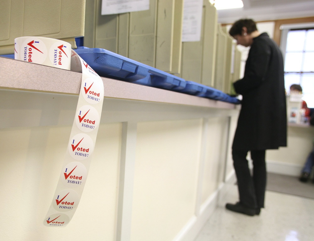 Mary Rose MacKinnon of Portland votes early in the city clerk’s office in Portland City Hall n the runup to Election Day 2009. Maine doesn’t track the demographics of absentee voters, but it does tabulate individual absentee voters by town, party affiliation and the day and time ballots are received.