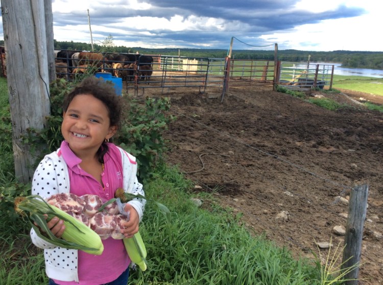 Gabriella Huegas with oxtails from Bisson's Meat Market in Topsham.