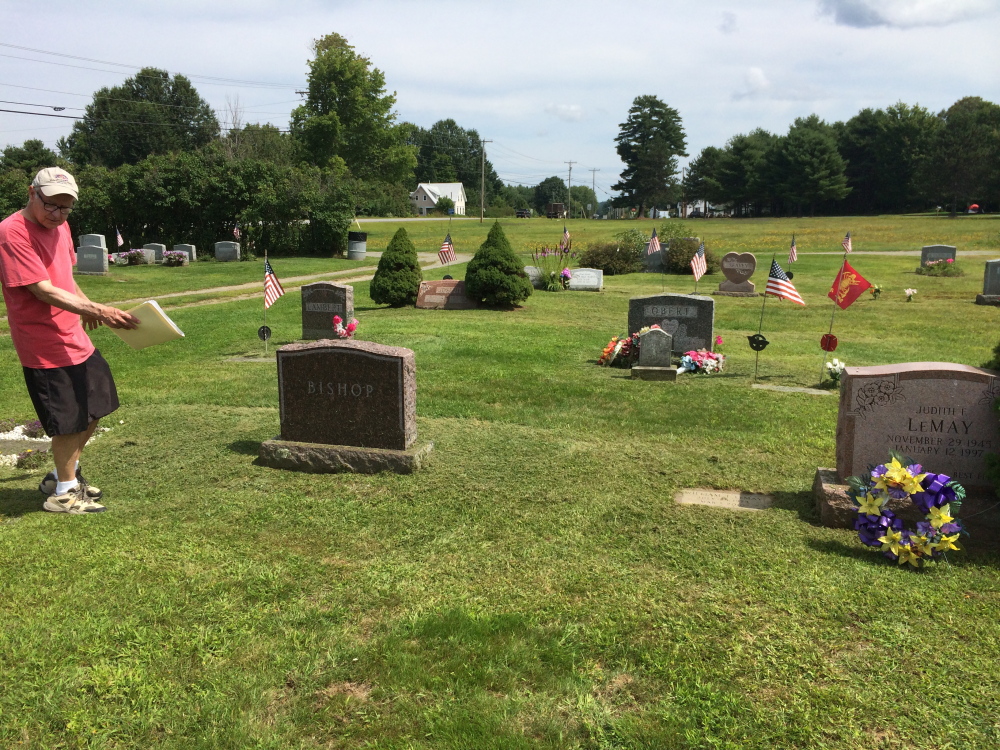 Stephen Bishop of Norridgewock walks through his family’s plot at Sunset View Cemetery on Thursday. Bishop is asking the town for help removing from the plot two headstones and remains that do not belong to his family.
