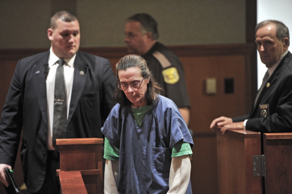 Kelly Boyer waits to plead guilty to her eighth OUI offense at the Cumberland County Courthouse in Portland on May 29.