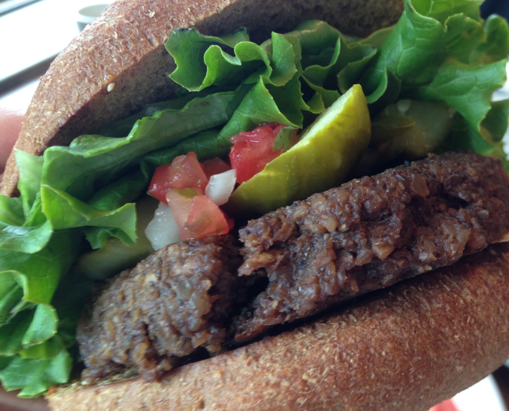 The walnut-oat burger at the Taste of Maine Restaurant is all vegan and has a flavor reminiscent of Thanksgiving stuffing.