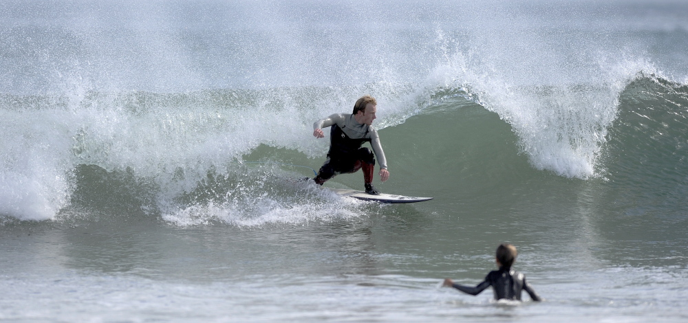 Beachgoers and surfers enjoyed a great summer day Thursday at Kennebunk Beach in southern Maine.