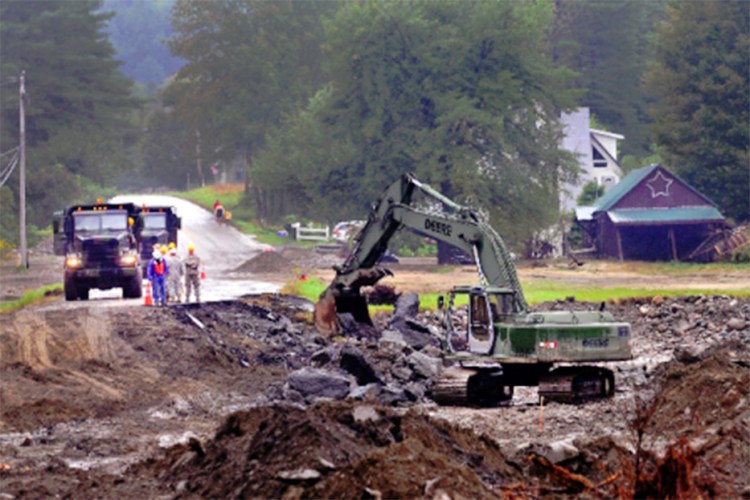 Soldiers from 262nd Engineer Company clear debris from Vermont State Highway 101, during Hurricane Irene Relief Operations in September 2011. Maine Army National Guard photo