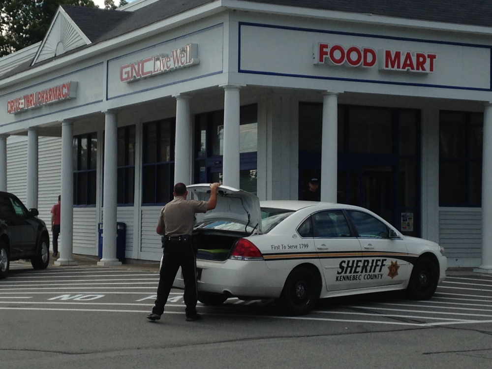 Kennebec County sheriff’s deputies respond to a robbery at the Manchester Rite Aid on Saturday. A woman dressed in men’s clothes held up the pharmacy for prescription drugs and fled. A police dog was brought in to try to track the robber.