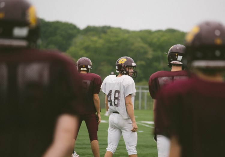 Cape Elizabeth quarterback Noah Wolfinger helped his team pull off a 35-34 win over Leavitt in its season opener last week. That was a nice start, but now practice continues as the Capers try to “reach the mountaintop.”