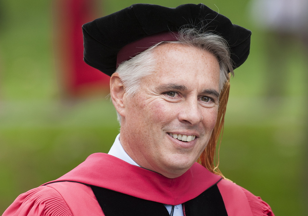 Colby College President David Greene smiles as he walks to his inauguration Saturday in Waterville.