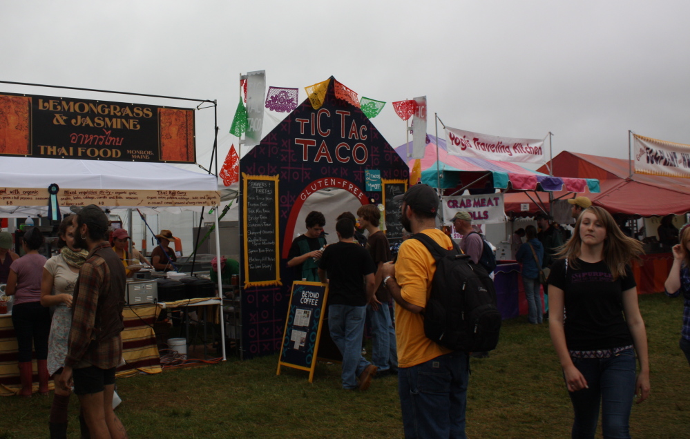 Food vendors line the Common Ground Country Fair food court, offering Thai stir fries, gluten-free vegan tacos and hummus-and-eggplant sandwiches.