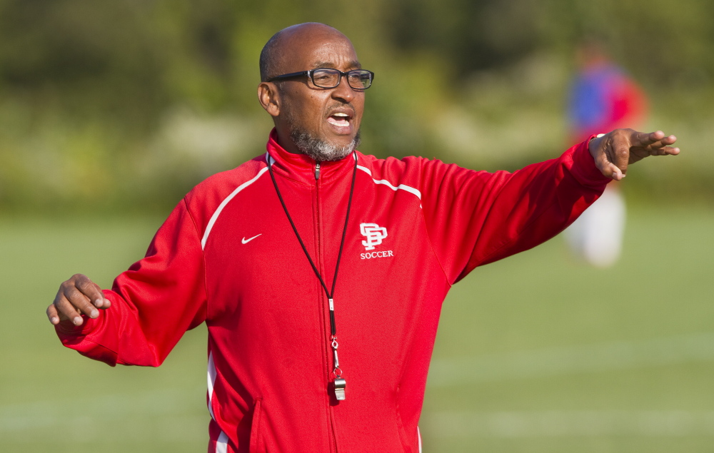 South Portland JV coach Aweis Suja Abdalla conducts practice on Monday. Aweis' sons Ahmed and Khalid Suja play on the  South Portland varsity soccer team.