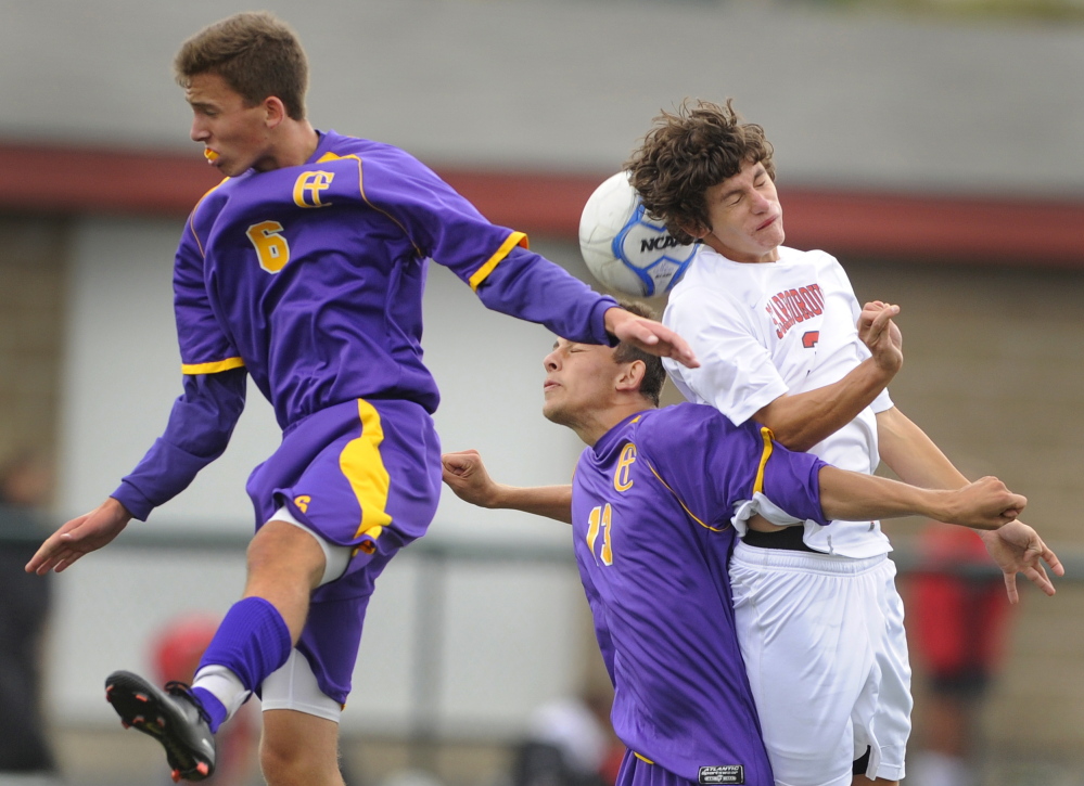 Derek Hammond, left, and Andrei Vile challenge Scarborough’s Matt Caron for a high ball. Caron scored the game’s first goal, and the Red Storm recorded their fourth shutout in six games this season.