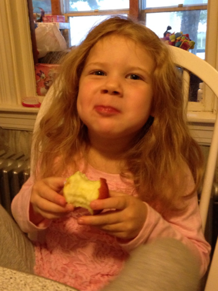 MJ, 3, tries an apple from Super Chilly Farm in Palermo. Photos by Meg Davis