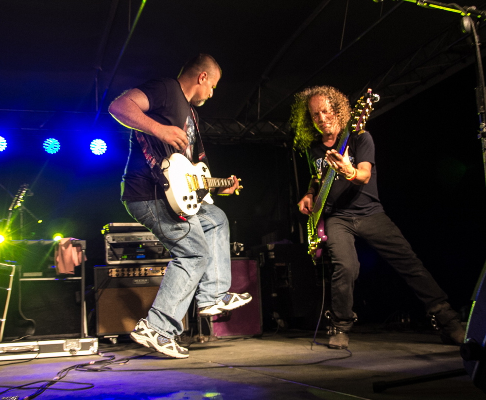 Shawn Theriault, left, and Eric Mauriello of the Portland band American Ride perform in August at an outdoor festival in Hebron. The band will film its show Saturday for a video answer to superstar Tim McGraw’s new song “Portland, Maine.”