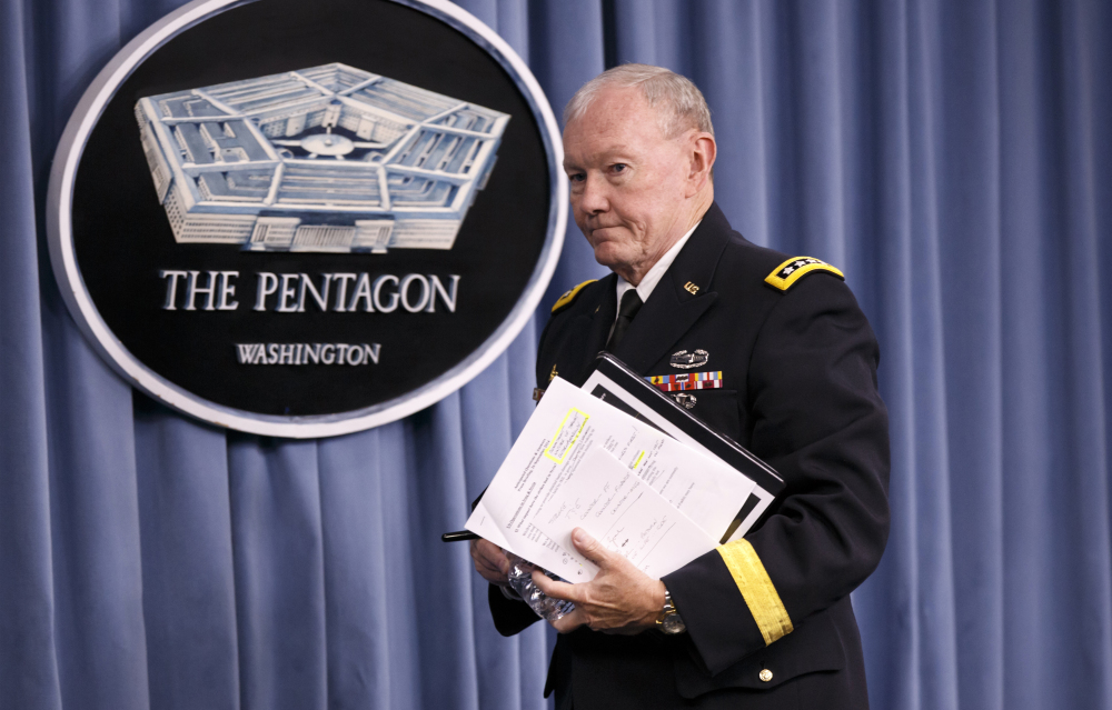 Joint Chiefs Chairman Gen. Martin Dempsey leaves a news conference at the Pentagon Friday after briefing reporters about ongoing operations against Islamic extremists in Syria and Iraq.