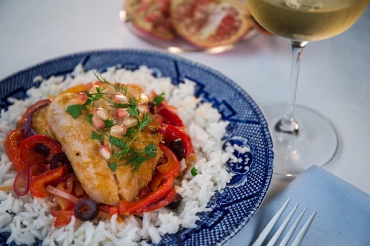 For this fish tagine, a mixture of tomatoes, eggplant, onions and peppers is gently simmered then pieces of halibut, or other fish, are added. The whole cooks into a savory stew laced with warm spices.