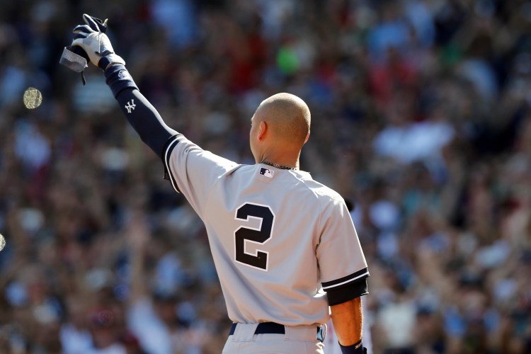 Derek Jeter waves to the crowd after being replaced by a pinch runner during the third inning against the Boston Red Sox at Fenway Park. on Sunday. Greg M. Cooper/USA TODAY Sports