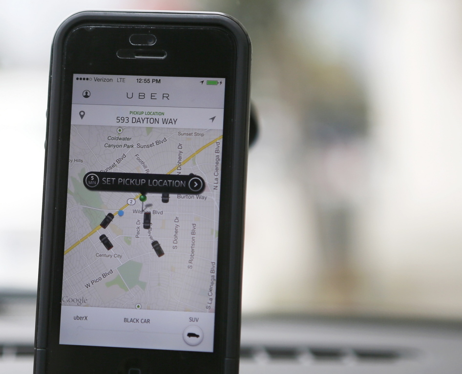 An Uber app is seen on an iPhone. Uber has entered markets in more than 200 cities, ranging from its hometown of San Francisco to Tokyo. It arrived in Portland in October.