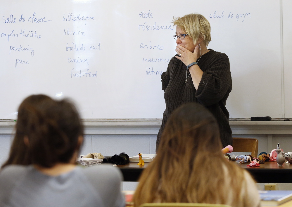 Nancy Erickson, who has taught at USM for 18 years, is briefly overcome by emotion during her French class Monday after learning that the undergraduate French program is targeted for elimination. “I’m a little bit shocked,” she said in an interview.