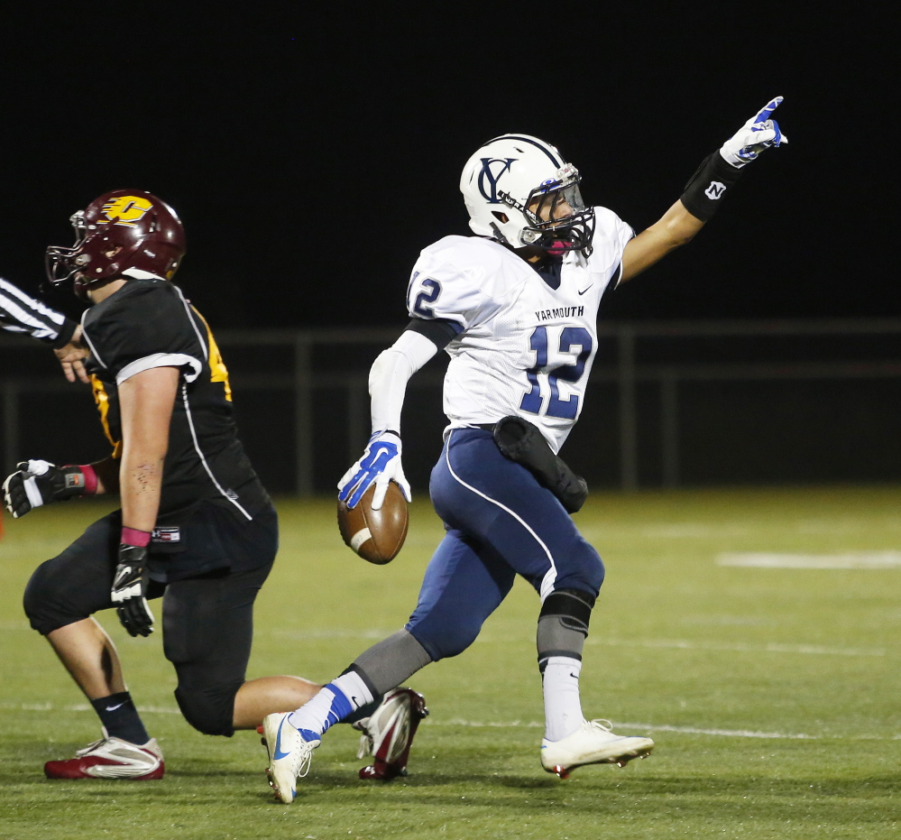 CAPE ELIZABETH, ME - OCTOBER 31: Arthur Chee of Cape Elizabeth points to the Yarmouth fans in the bleachers after coming up with a big reception during the third quarter. (Photo by Derek Davis/Staff Photographer)