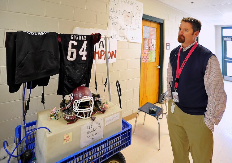 Gorham High School Athletic Administrator Timothy Spear stands by the school's tribute to Branden Denis, who died in a traffic accident Sunday in Bridgton.