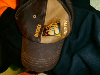 The suspect lost his ball cap, above, in the struggle for the purse.