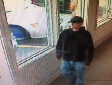 A purse-snatching suspect is caught on video surveillance.