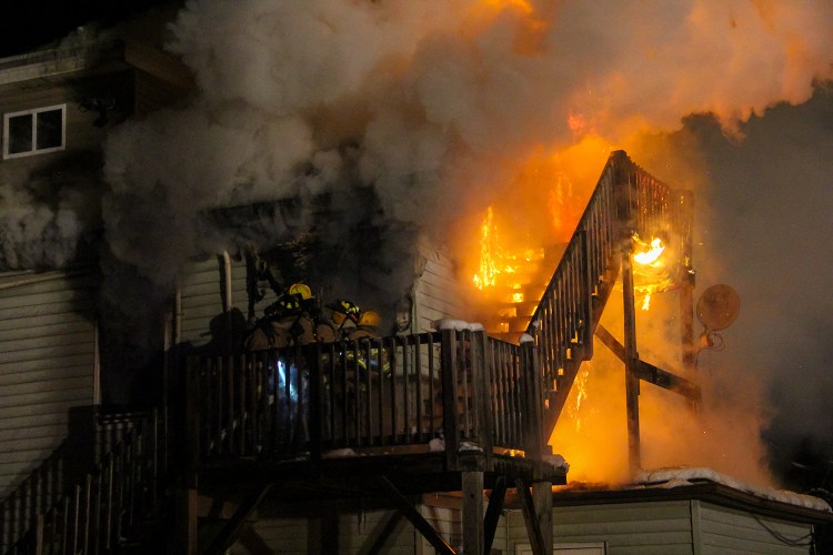 Firefighters make their way into a second floor apartment late Friday night during a 2nd Alarm fire on Old Pine Hill Road South in Berwick. Photo courtesy of Shawn St.Hilaire