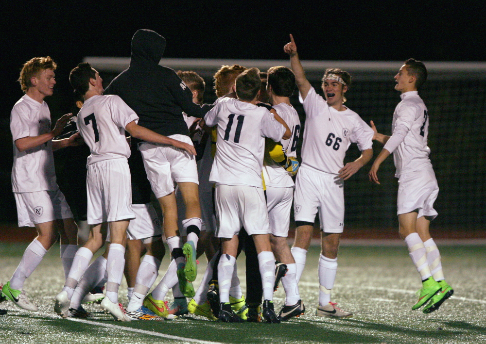 Yarmouth celebrates winning the Western Class B championship Wednesday in Yarmouth. The top-seeded Clippers beat No. 2 Greely, 4-2.