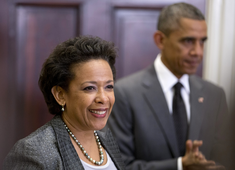 President Barack Obama listens as U.S. Attorney Loretta Lynch speaks in the Roosevelt Room of the White House in Washington on Saturday. The president announced he would nominate Lynch to replace Attorney General Eric Holder.