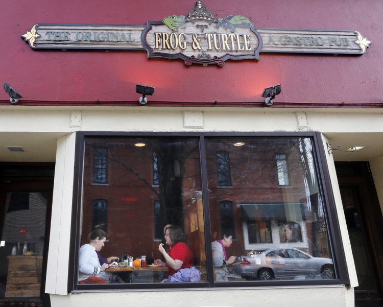 People dine at the Frog & Turtle Gastro Pub in Westbrook in 2014.