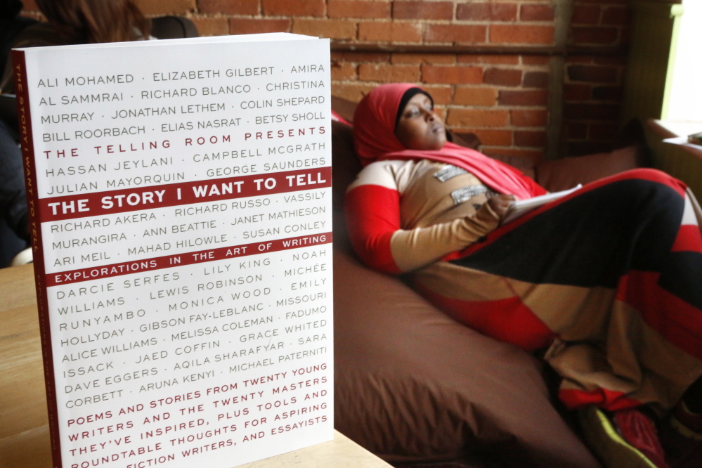 Gregory Rec/Staff Photographer
Fadumo Awale, a senior at Portland High School, mulls story ideas at The Telling Room. In the foreground is the center’s new anthology.