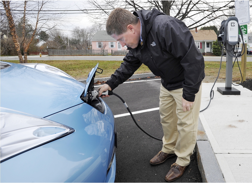 City Manager Jim Gailey charges the city’s new Nissan Leaf. “You gotta have the infrastructure in place ... for people to operate electric vehicles,” he said.